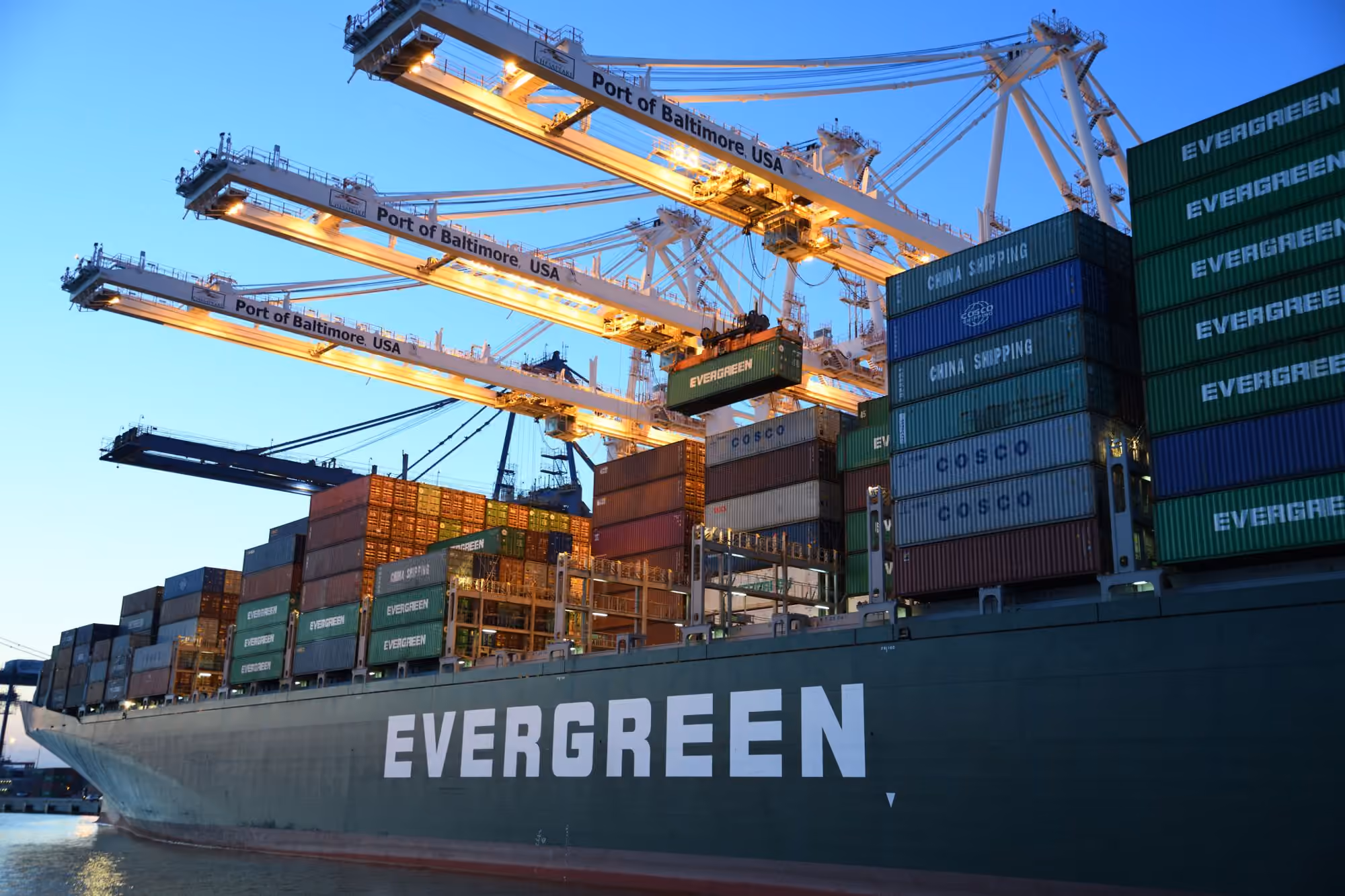 Container terminal with gantry cranes loading a vessel